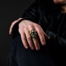 STS R01Br Brass Skull Ring on male model.