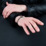 Oz Abstract Tokyo BR263BCZ No Regrets silver cross bracelet with black zirconia on male model.