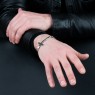 Oz Abstract Tokyo BR263WCZ No Regrets silver cross bracelet with zirconia on male model.
