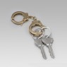 Brass handcuff key holder.
