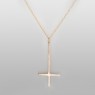 Reversed gold cross necklace.