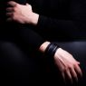 Oz Abstract Tokyo original hand made double stud wrist band. Black color on male model view. 