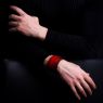 Oz Abstract Tokyo original hand made double stud wrist band. Red color on male model.