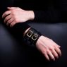 Oz Abstract Tokyo original hand made double buckle wrist band. Brown color on male model. 