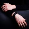 Oz Abstract Tokyo original hand made single stud wrist band. Black snake skin color on male model. 
