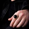 Oz Abstract R9329 Cardinal ring with Onyx on male model.