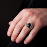 Oz Abstract R455 Spade ring with Black Star up on male model.