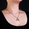 M`s Collection NS028 cross and anchor brass necklace on female model.