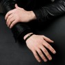 Oz Abstract Tokyo Cro-Sv Cross design leather bracelet on male model.