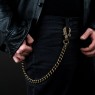 STS brass wallet chain skull design on male model.