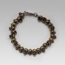 Oz Abstract Tokyo brass skulls Crocodile Hunter bracelet front low view.