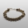 Oz Abstract Tokyo brass skulls Crocodile Hunter bracelet front low view.