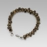 Oz Abstract Tokyo brass skulls Crocodile Hunter bracelet front view.