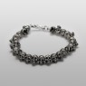 Oz Abstract Tokyo silver skulls Crocodile Hunter bracelet front low view.