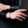 BigBlackMaria X bangle bracelet from brass on male model.