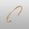 BigBlackMaria X bangle bracelet from brass up left view.