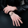 BigBlackMaria X curb silver bracelet on male model.