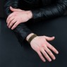 Oz Abstract Tokyo Silk ribbon bracelet with Bronze cross on male model.