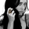 STS R20BR Brass Skull Ring on female model.