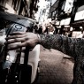 Oz Abstract Tokyo BR262 No Regrets silver cross bracelet on male model.