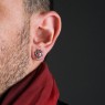 M`s Collection silver pierces with red zirconia on male model. 