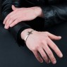 Oz Abstract Tokyo BR263BCZ No Regrets silver cross bracelet with black zirconia on male model.