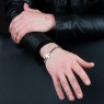 Oz Abstract Tokyo BR263WCZ No Regrets silver cross bracelet with zirconia on male model.