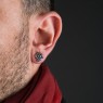M`s Collection stone encrusted silver pierce with synthetic sapphire on male model.