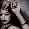Oz Abstract Tokyo silver skulls Crocodile Hunter bracelet on female model.