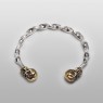 Twisted Silver bracelet with brass skulls by STS.