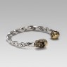 Twisted Silver bracelet with brass skulls by STS.