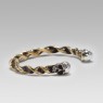Twisted brass bracelet with silver skulls by STS.