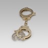 Brass handcuff key holder.