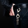Brass handcuff key holder.