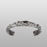 Maria and skull twisted bangle by Solid Traditional Silver.