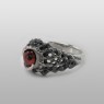 Red eye ring by strange freak designs.