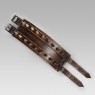 Leather bracelet with brass studs.